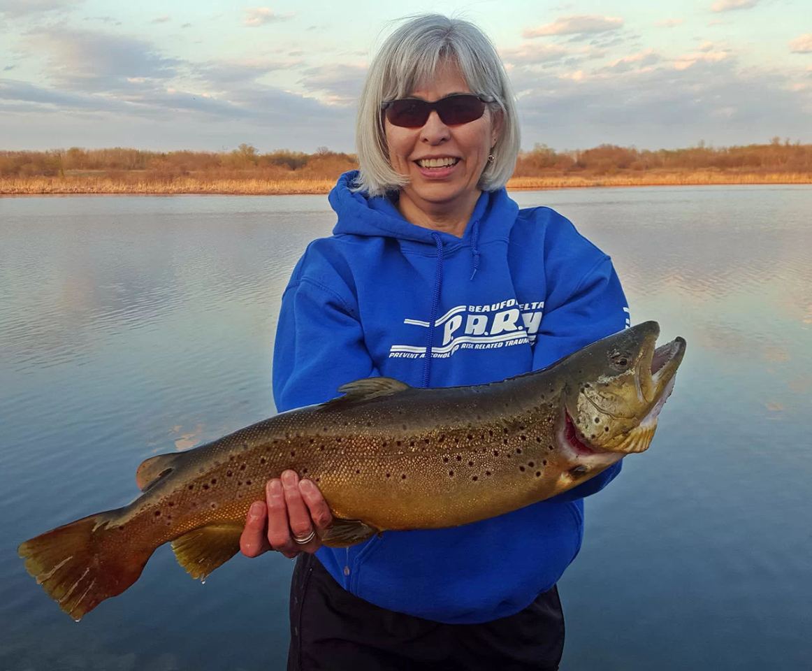 Woman holding a large fish