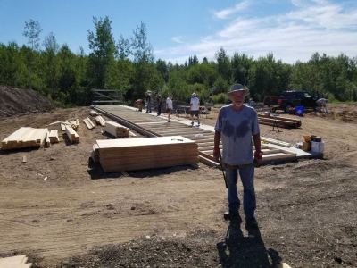 Construction worker standing in front of the worksite